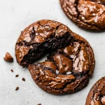 Stack of fudgy, chewy brookies — a mix between brownies and cookies — styled as Chocolate Brownie Cookies, perfect as a Homemade Brownie Cookies Dessert or fun Easy Baking Recipes Desserts idea.