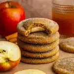 Close-up of soft, chewy Apple Cider Cheesecake Cookies with a creamy cheesecake center, topped with spiced sugar, perfect Autumn Themed Treats for Fall Festive Food and Fall Flavor Desserts.